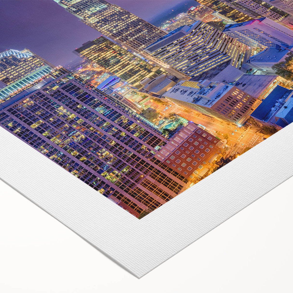 Art deco poster of Charlotte skyline in muted blue tones on rolled canvas, suitable for dining room decor.
