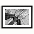 Extra large, textured abstract art print of Brooklyn Bridge in colorful hues on a black framed mat.