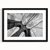 Extra large, textured abstract art print of Brooklyn Bridge in colorful hues on a black framed mat.