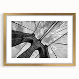 Extra large wall art featuring a textured abstract print of the Brooklyn Bridge in muted gray and gold tones on a framed…