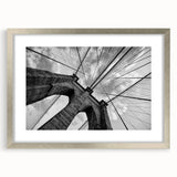 Textured art print of Brooklyn Bridge in abstract style with muted gray and silver tones on a framed canvas.