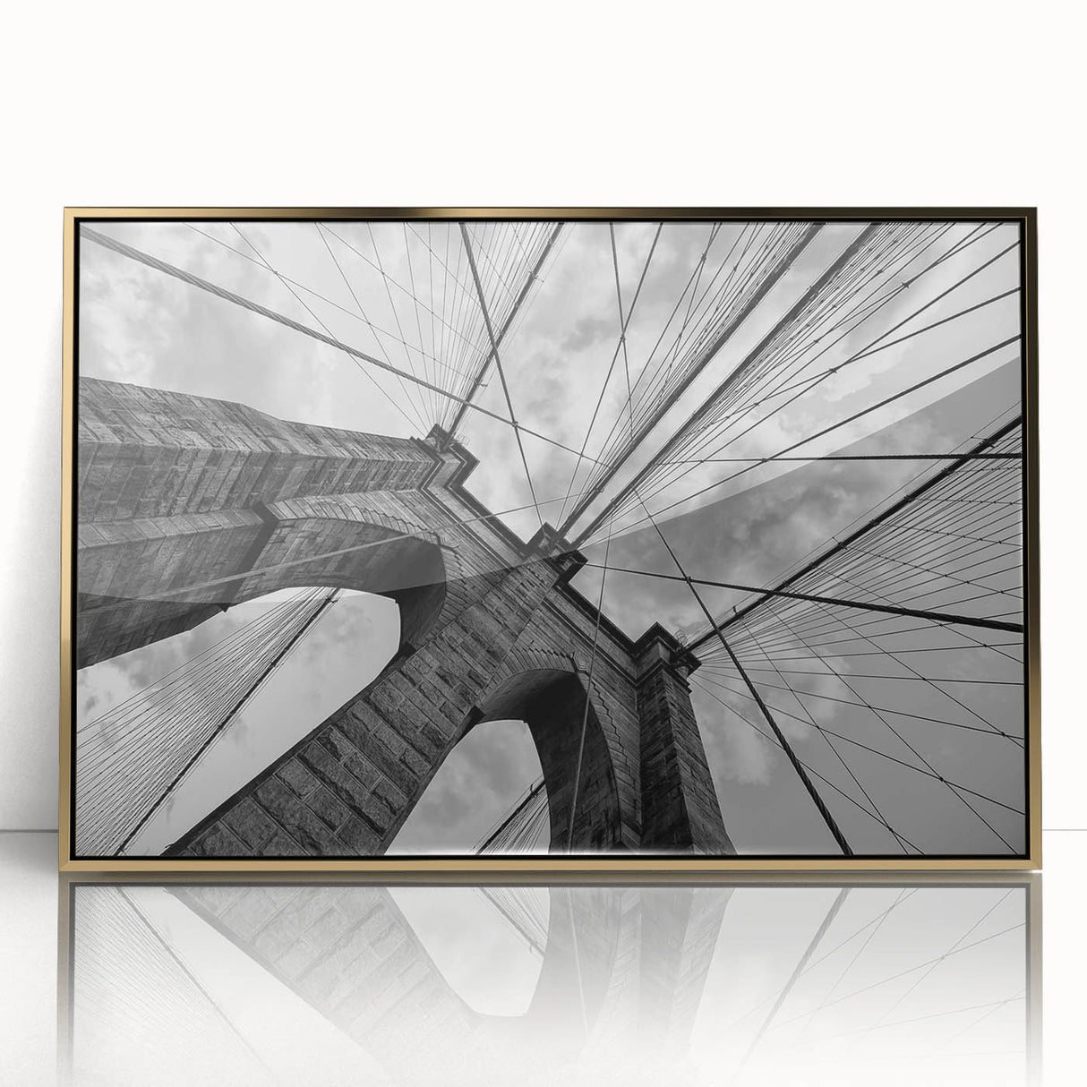 Acrylic print of the Brooklyn Bridge with a gold frame, featuring muted gray and blue tones, ideal for modern art wall decor.