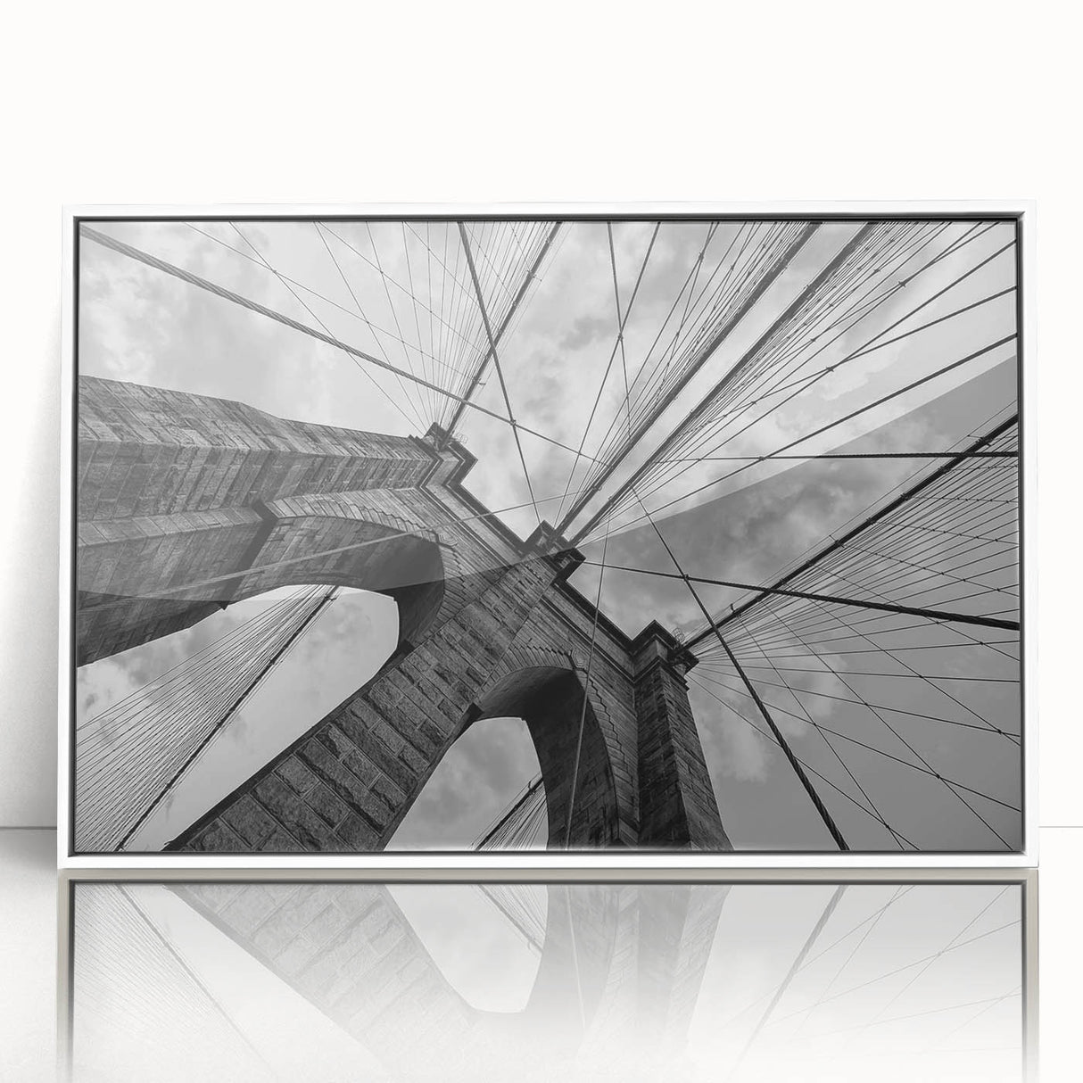 Acrylic print of Brooklyn Bridge in muted gray tones, framed in white, ideal for modern art wall decor.