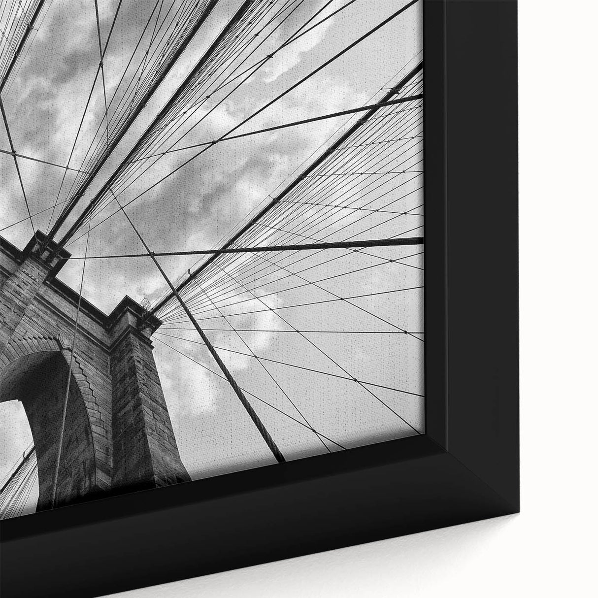 Framed canvas featuring a close-up, textured depiction of the Brooklyn Bridge in black with colorful accents.