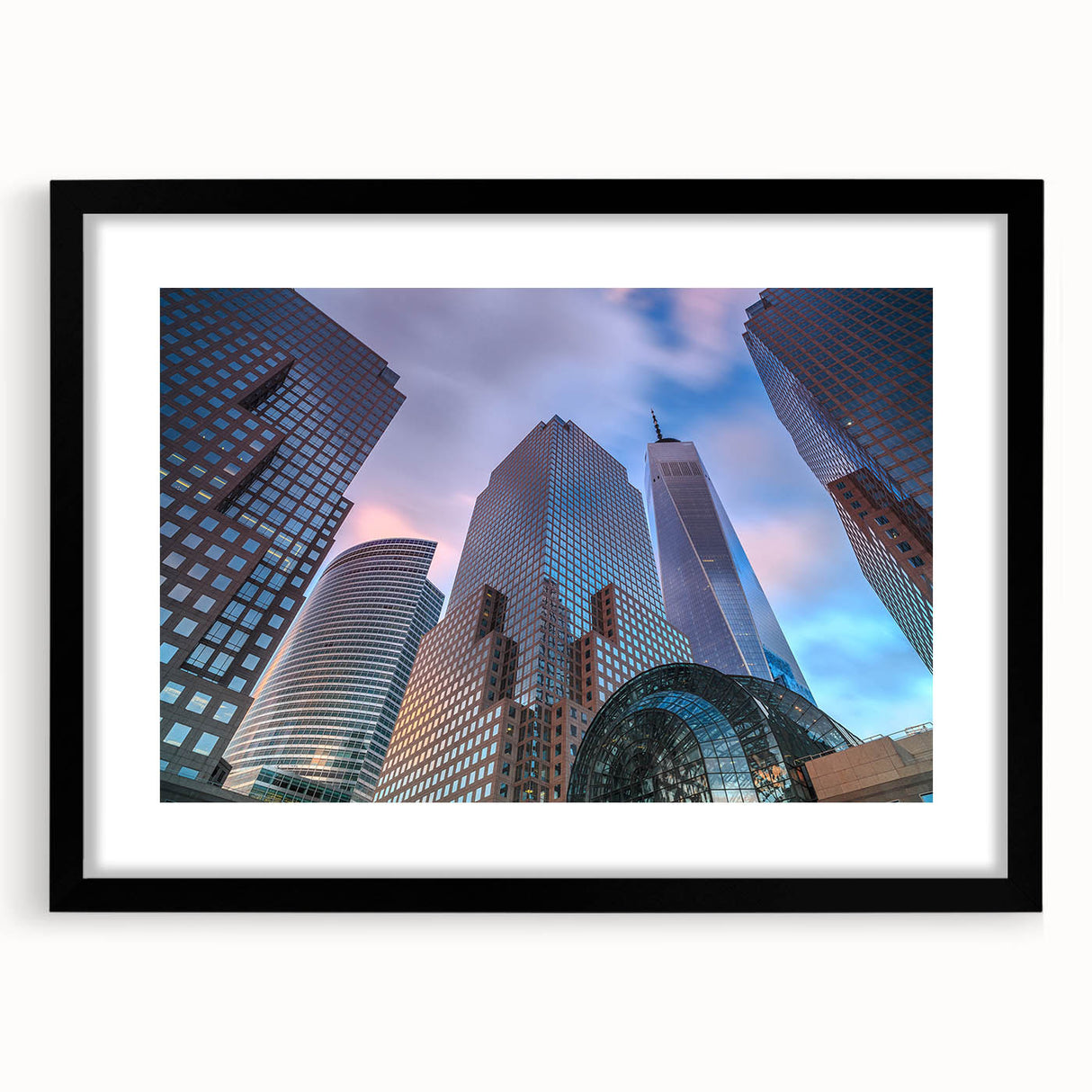 Abstract art print of Manhattan skyline in muted gray and blue tones, framed with a black mat.