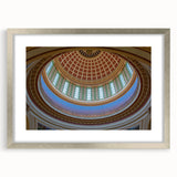 Textured art depicting abstract scenery in muted earth tones on a silver-framed mat, suitable for bedroom decor.