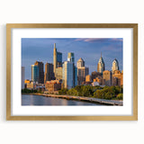 Extra large abstract art print of Philadelphia skyline in textured gold frame, ideal for living room decor.