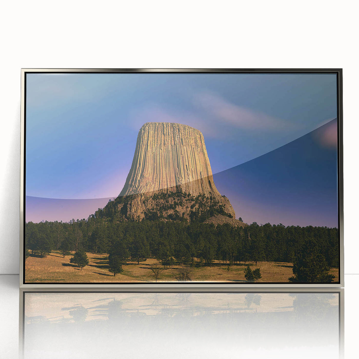 Mid-century modernist art depicting the Badlands in South Dakota, with soft earth tones on a silver-framed acrylic print.
