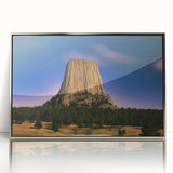 Mid-century modernist art depicting the Badlands in South Dakota, with soft earth tones on a silver-framed acrylic print.