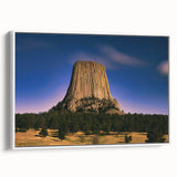 Vintage poster art of South Dakota Badlands in vibrant colors on a large framed canvas, ideal for living room decor.