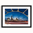 Colorful abstract art print of Nashville skyline, in a black frame with mat, ideal for living room decor.