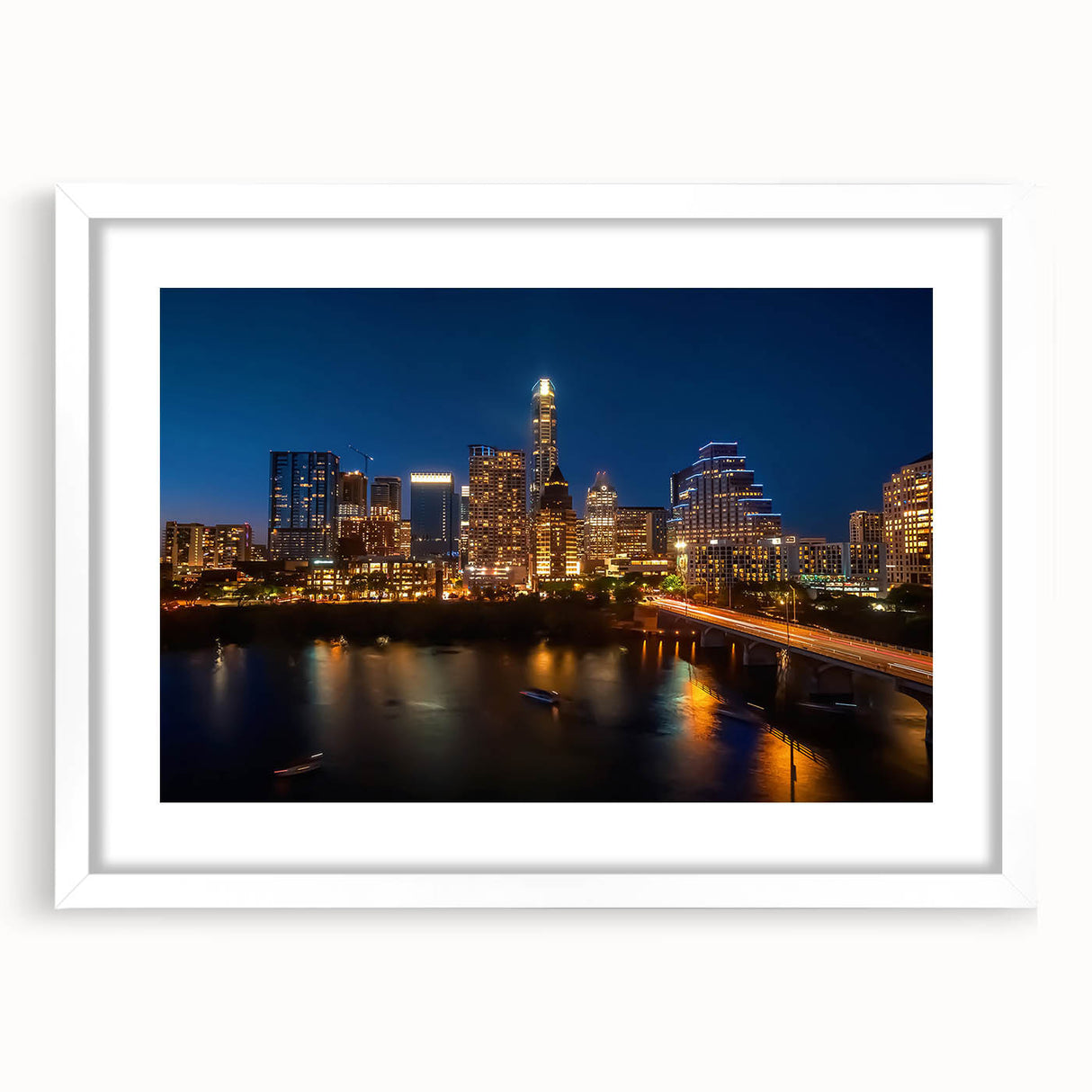 Abstract art print of Austin skyline in muted gray and blue tones on a framed white mat.