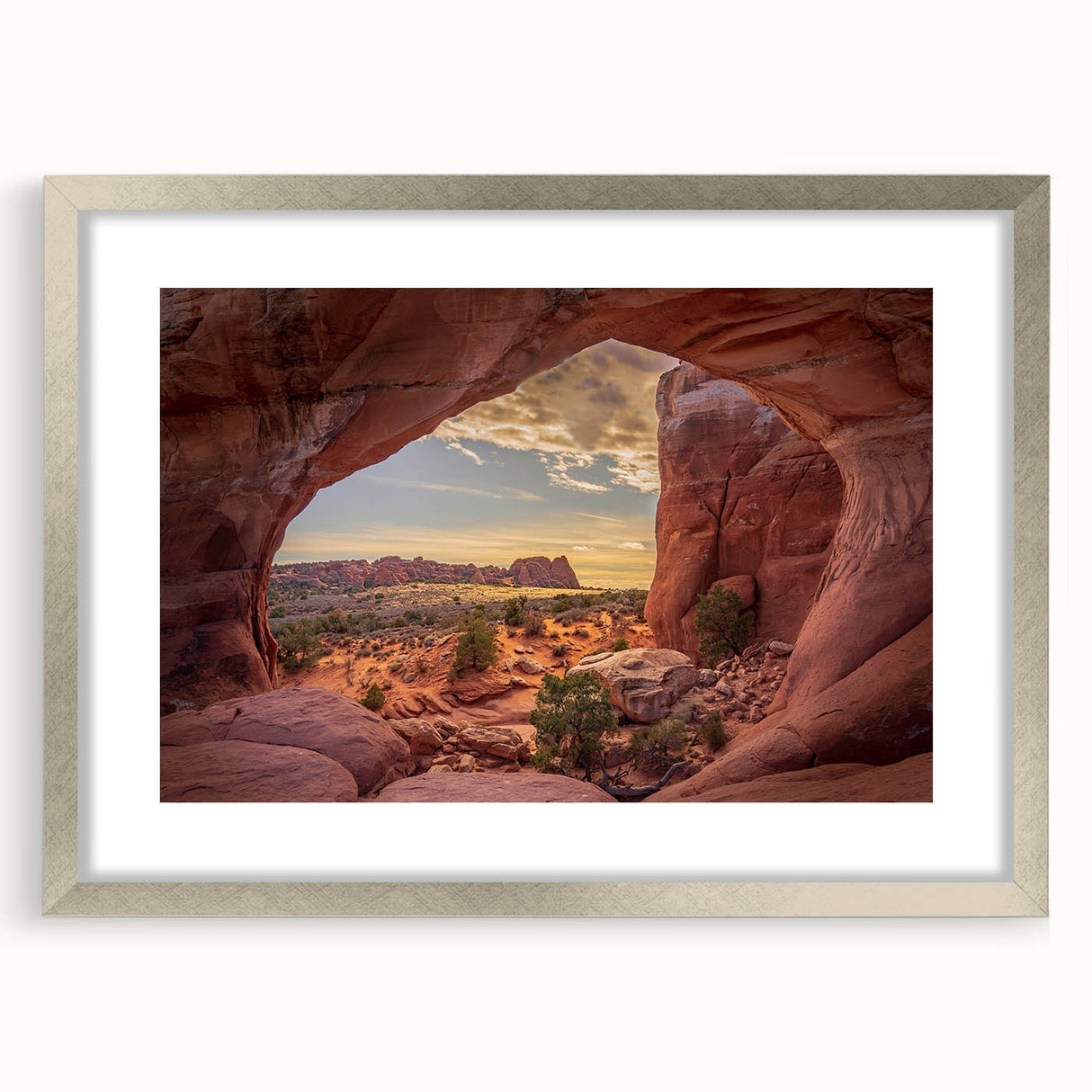 Textured art print of Arches National Park in muted earth tones on a framed canvas, suitable for bedroom decor.