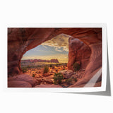 Rolled canvas print of Arches National Park in Utah, featuring red rock formations under a blue sky.
