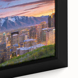 Black wall art featuring a textured depiction of Salt Lake City with colorful elements, framed canvas.