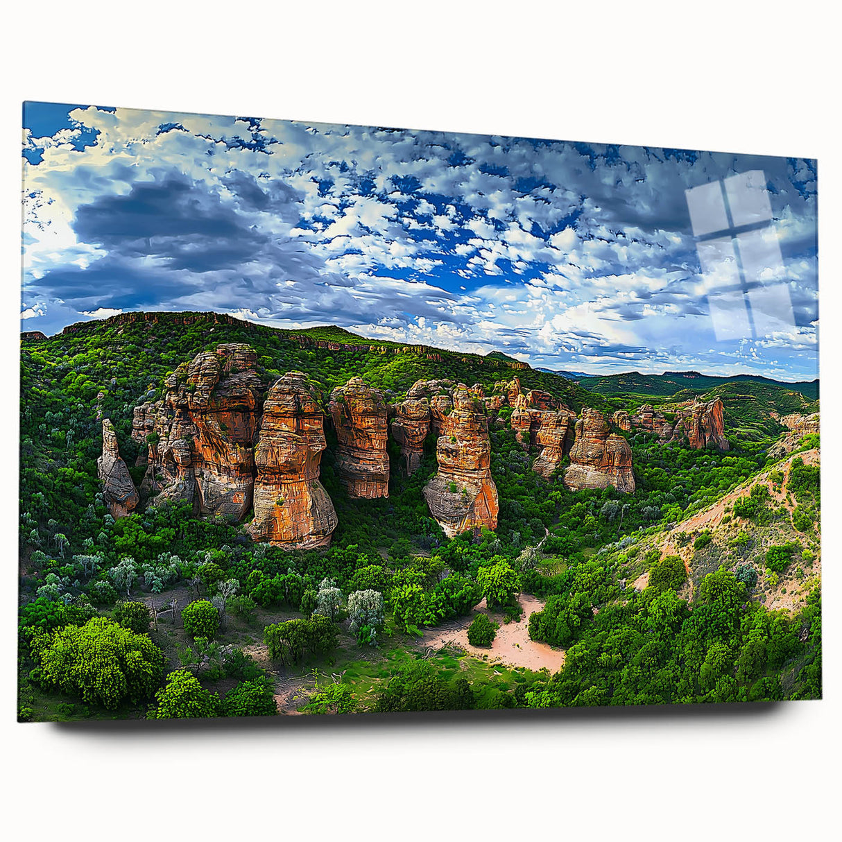 Acrylic wall art showcasing a vibrant landscape of cliffs, displayed in a sleek glass frame, highlighting detailed textures and colors for modern décor.