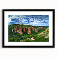 Black-framed landscape art print showcasing a dramatic cliff scene, elegantly matted for display, perfect for enhancing home decor with a modern touch.