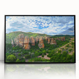 Framed acrylic artwork depicting dramatic cliffs in a landscape setting, featuring vibrant colors and sharp details, perfect for modern home decor.