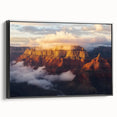 Framed landscape artwork depicting dramatic canyons, showcasing earthy tones and intricate details, presented in a sleek black frame for elegant home decor.