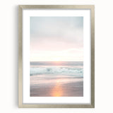 Textured abstract art print in silver frame, featuring swirling gray patterns on a white background.