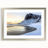 Silver-framed landscape artwork depicting serene beaches with soft waves and blue skies, elegantly matted for a polished presentation, perfect for coastal decor.