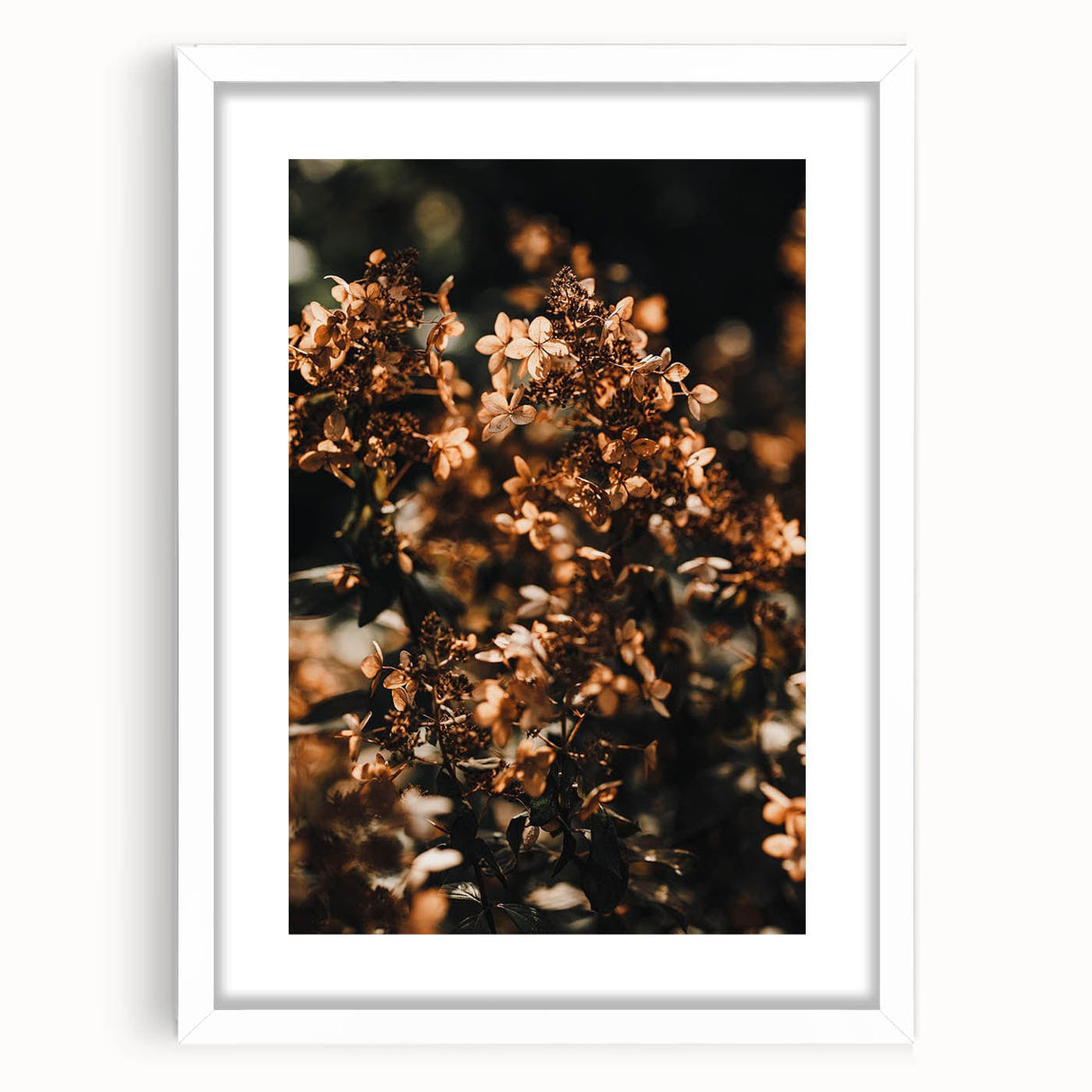 Abstract art print depicting autumnal trees in orange and red tones on a white framed canvas, ideal for dining room decor.