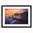Framed landscape artwork depicting dramatic cliffs in a black mat, showcasing intricate details and vibrant colors, perfect for home decor or office space enhancement.