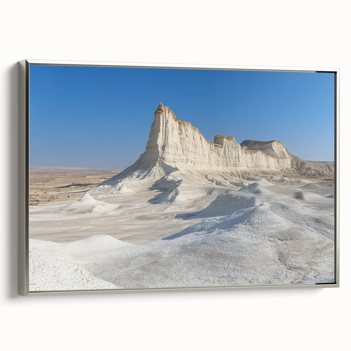 Framed landscape canvas artwork depicting stunning canyons in vibrant earthy tones, showcasing intricate details, mounted in a sleek silver frame for a modern aesthetic.