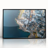 Framed acrylic artwork showcasing a dramatic cliff landscape with vibrant colors and intricate details, presented in a sleek black frame for an elegant display.