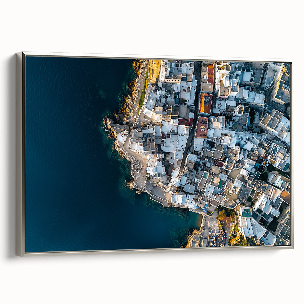 Framed canvas artwork depicting a scenic landscape of cliffs with a silver border, showcasing a serene view ideal for modern home decor, enhancing interior aesthetics.