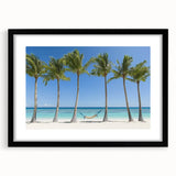 Black-framed landscape artwork featuring vibrant beach scene with soothing blue waters and golden sands, designed to enhance home decor and create a serene atmosphere.
