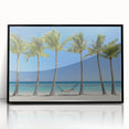 Framed acrylic artwork displaying a serene beach landscape with vibrant blues and sandy tones, featuring a sleek black frame for modern decor appeal.
