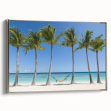 Framed landscape canvas artwork showcasing a serene beach scene with gentle waves and soft golden sands, bordered by a sleek silver frame, ideal for coastal home decor.