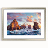 Framed landscape artwork featuring dramatic cliffs and serene water, showcased in a sleek silver frame with a mat, ideal for modern home decor.