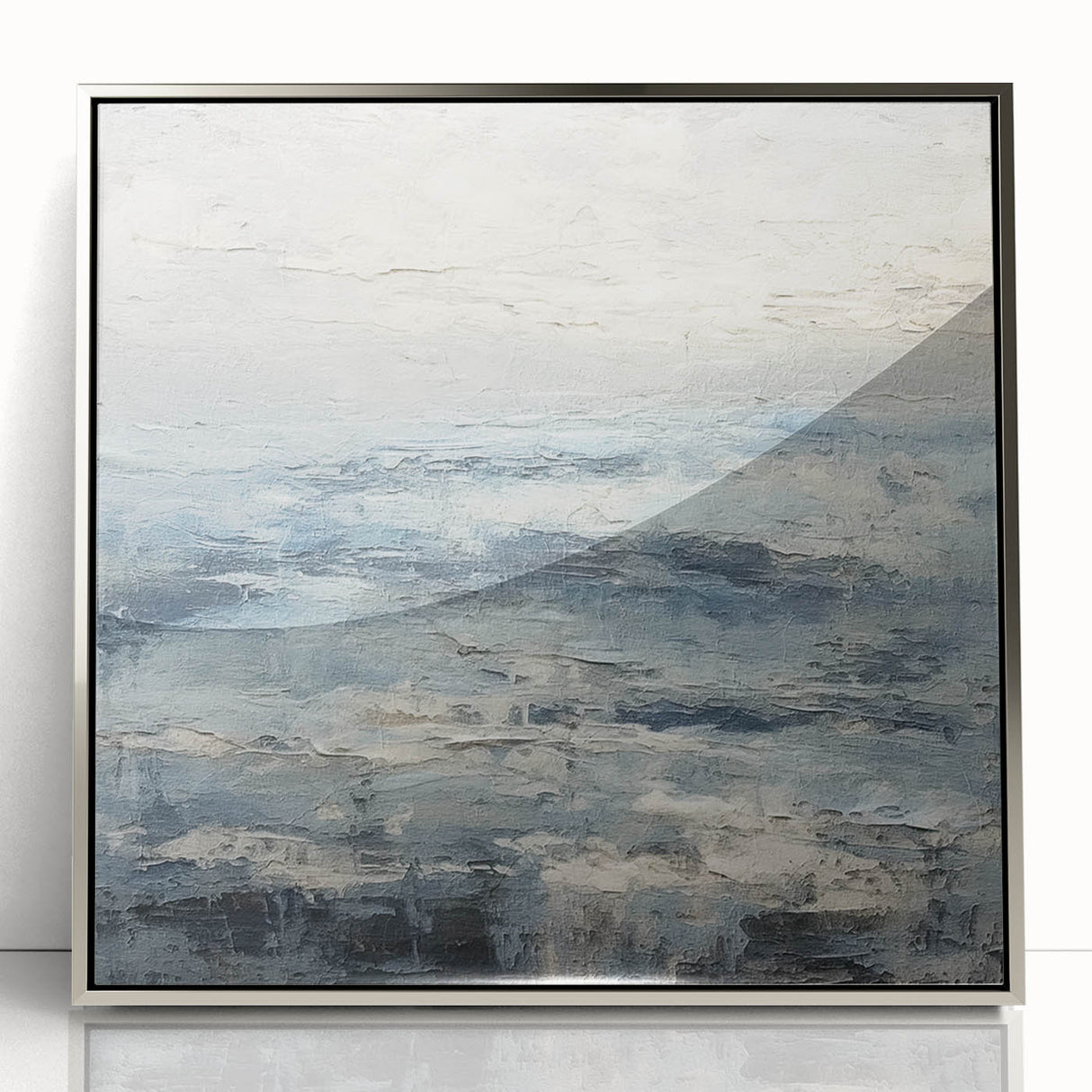 Framed acrylic wall art depicting abstract landscapes in silver tones, showcasing fluid forms and modern design for contemporary home decor.