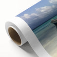 Stunning rolled canvas depicting a serene beach landscape with vibrant colors, ideal for home decor, packaged securely in a protective tube for easy transport.