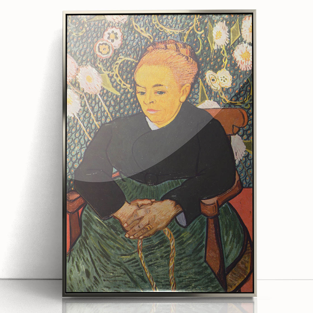 Large art print of Van Gogh's Starry Night in a silver frame, featuring swirling blue and yellow tones.