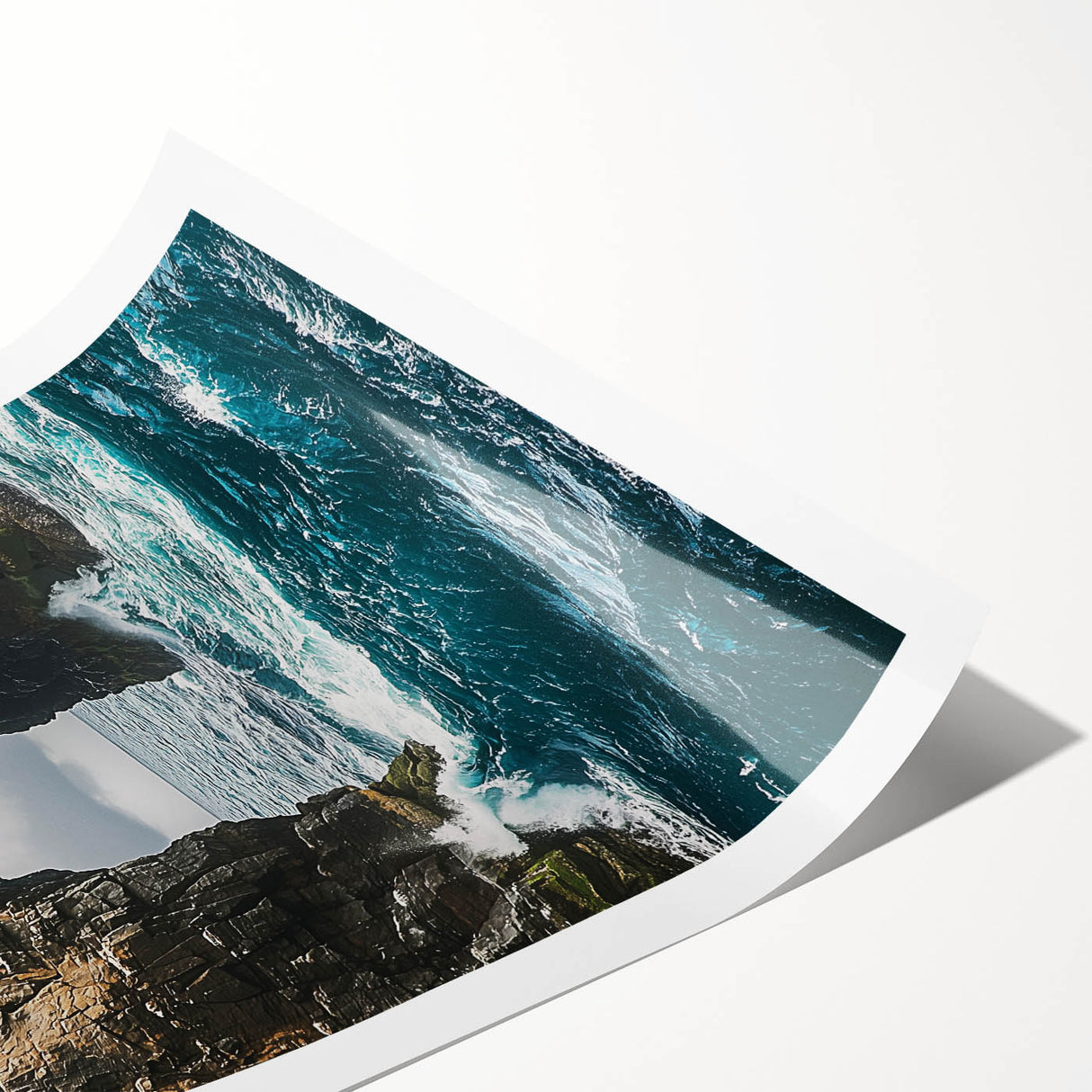 Stunning rolled print showcasing a vibrant landscape scene of majestic cliffs under a bright blue sky, elegantly packaged in a protective cardboard tube for easy display.