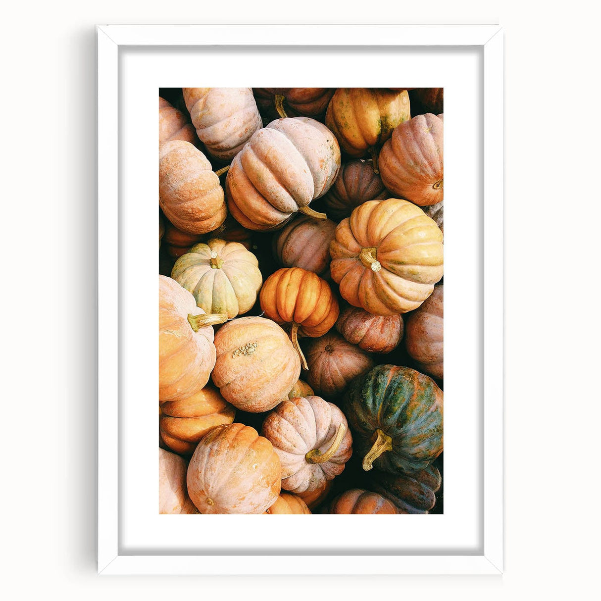 Abstract art print featuring swirling autumnal colors in red and orange on a white framed canvas.
