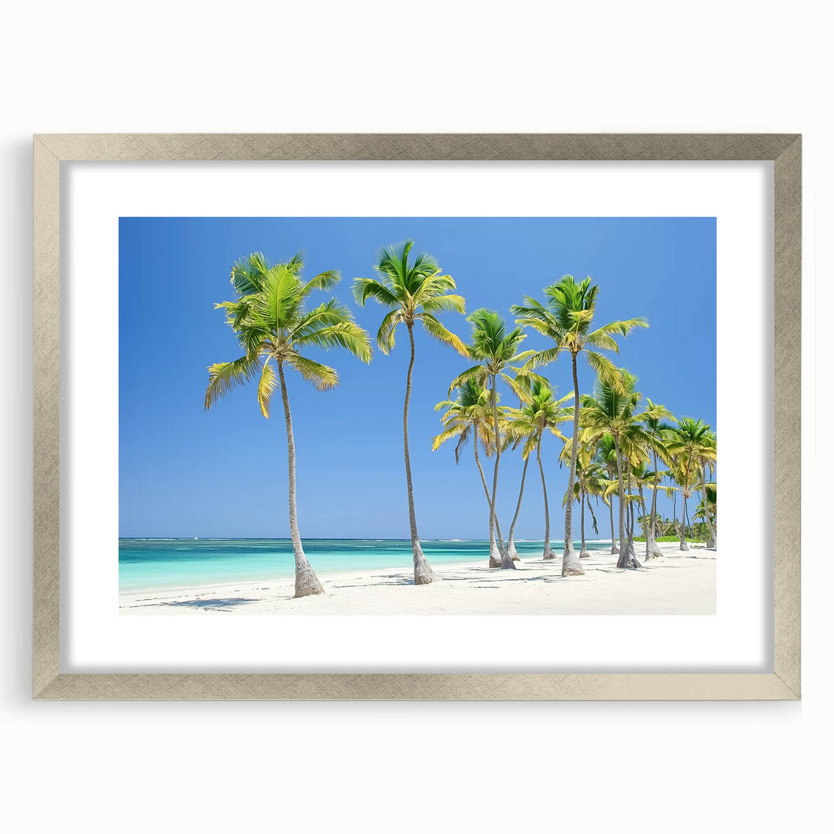 Silver-framed landscape artwork featuring a serene beach scene with vibrant colors, elegantly matted for display, ideal for home decor or coastal-themed interiors.