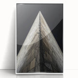 Art deco poster of geometric buildings in black and white tones on a framed acrylic, ideal for nursery wall art.