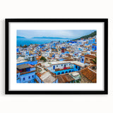 Extra large abstract art print of a Moroccan landscape in vibrant colors on textured canvas, framed in black.