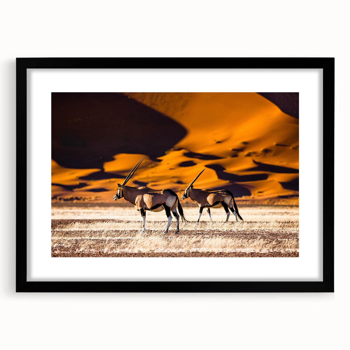 Extra large abstract art print of African scenery in vibrant colors on a textured canvas, framed in black.