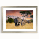 Textured art print depicting abstract African scenery in earth tones, framed in silver, ideal for bedroom decor.