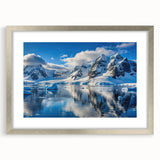 Textured abstract art print of an Antarctic landscape in muted blue and white hues, framed in silver, ideal for bedroom art.