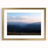 Extra large abstract art print depicting textured scenery in muted earth tones, framed in gold, ideal for living room decor.