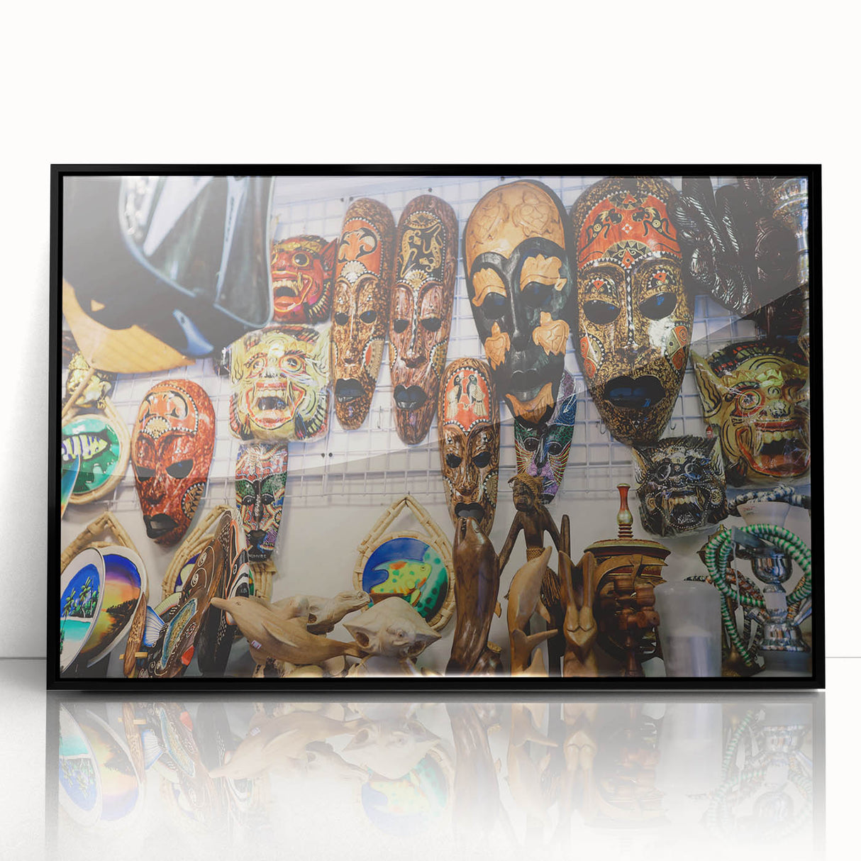 Large abstract wall art of a Maldivian scenery in muted blue and green tones, framed in black acrylic.