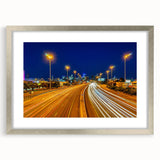 Abstract art print of Melbourne scenery in silver frame with mat, featuring cool blue and gray tones.