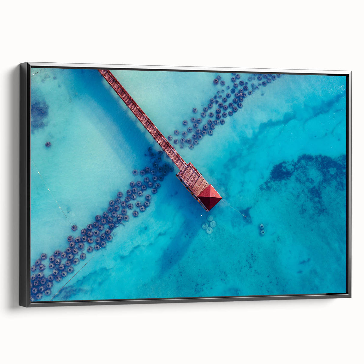 Black and white framed canvas of a Caribbean landscape, ideal for bedroom wall art.