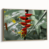 Framed canvas wall art of a vintage-style Caribbean landscape with lush greenery and ocean in muted gold and black tones.